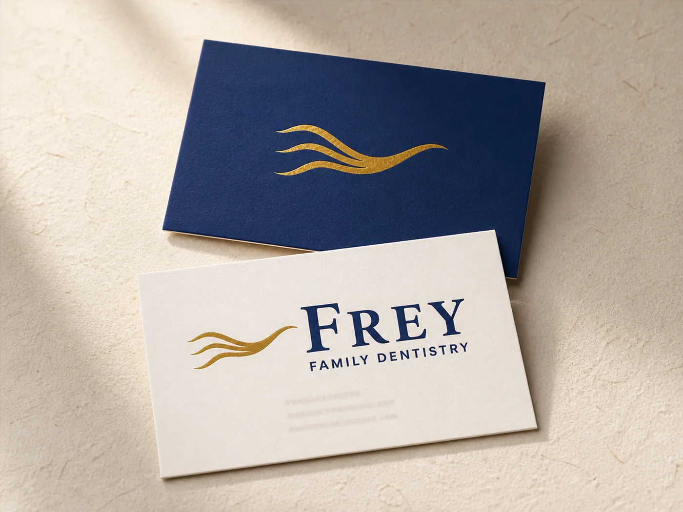 Frey Family Dentistry business cards on paper